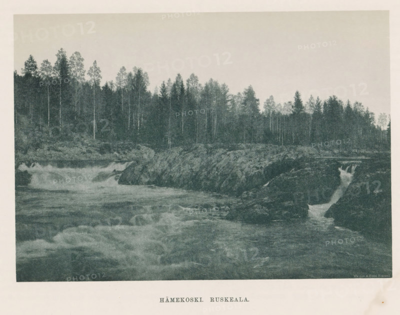 View of rocks and a rapid in a river, Hämekoski. Ruskeala, page, photomechanical print, photographer: Impi Backman, cliché maker: anonymous, printer (person): Weilin & Göös, c. 1888 - c. 1893, printer (person), paper, autotypie, height 157 mm x width 221 mm, river, rocks, rapids, Karelia, A wide river scene with turbulent water flowing over and around dark rocky outcrops in the foreground and midground, a narrow cascade of water dropping between rocks at the right, and a dense treeline of tall slender trees along the far bank beneath a pale, empty sky.