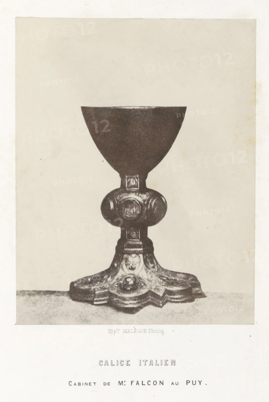 Italian chalice, Calice italien, photograph, page, number: 'PL. 11.', inscription: 'cabinet de Mr Falcon au Puy.', photographer: Hippolyte Malègue, France, c. 1850 - in or before 1857, paper, salted paper print, height 180 mm x width 140 mm, chalice, A monochrome photograph of a chalice centered on a plain light background, showing a smooth bowl atop a short stem that joins a rounded decorative node with carved circular motifs, which leads down to an ornate base with layered, scalloped edges and carved floral or emblematic details; the chalice sits on a flat surface and the image has a narrow border around it.