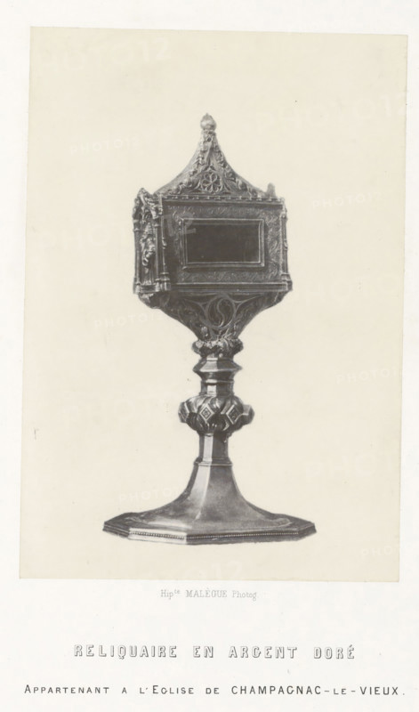 Silver reliquary from the Saint-Pierre church in Champagnac-le-Vieux, Reliquaire en argent doré, photograph, page, number: 'PL. 9.', inscription: 'appartenant a l'eglise de Champagnax-le-Vieux.', photographer: Hippolyte Malègue, France, c. 1850 - in or before 1857, Hippolyte Malègue, photographer, paper, salted paper print, height 180 mm x width 124 mm, relics (and reliquaries), A grayscale photograph of an ornate freestanding object resembling a decorative reliquary on a pedestal, centered on a plain light background; the top section has a pointed, triangular roof with carved floral and scrollwork details and a small finial at its peak, and below that a rectangular recessed panel framed by intricate molded ornamentation; the midsection narrows into a sculpted stem with rounded decorative elements and carved patterns, leading to a faceted bulbous node with geometric and floral motifs; the base flares outward into a broad, flat, slightly raised platform with a beveled edge and subtle be...