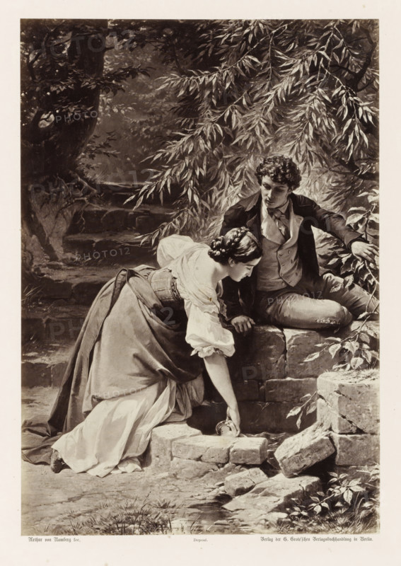 Hermann and Dorothea at the Spring, Photographic reproduction of a painting by AG von Ramberg, depicting Dorothea and Hermann at a spring, photograph, reproduction, Part of Album with photographic reproductions of paintings by AG von Ramberg after the work 'Hermann and Dorothea' by J.W. von Goethe., photographer: Franz Hanfstaengl, after painting by Arthur Georg von Ramberg, publisher: G.-Grote'sche Verlagsbuchhandlung, Berlin, 1871 - 1872, Franz Hanfstaengl, Arthur Georg von Ramberg, G.-Grote'sche Verlagsbuchhandlung, paper, albumen print, height 284 mm x width 197 mm, adolescent, young woman, maiden, youth, couple of lovers, A monochrome image of a young woman and a young man seated on and beside a low stone wall beneath drooping leafy branches, the woman leaning forward with one hand reaching down toward the ground while wearing a long dress with a fitted bodice and puffed sleeves and her hair styled in an updo, the man seated on the wall beside her looking toward her and dressed in...