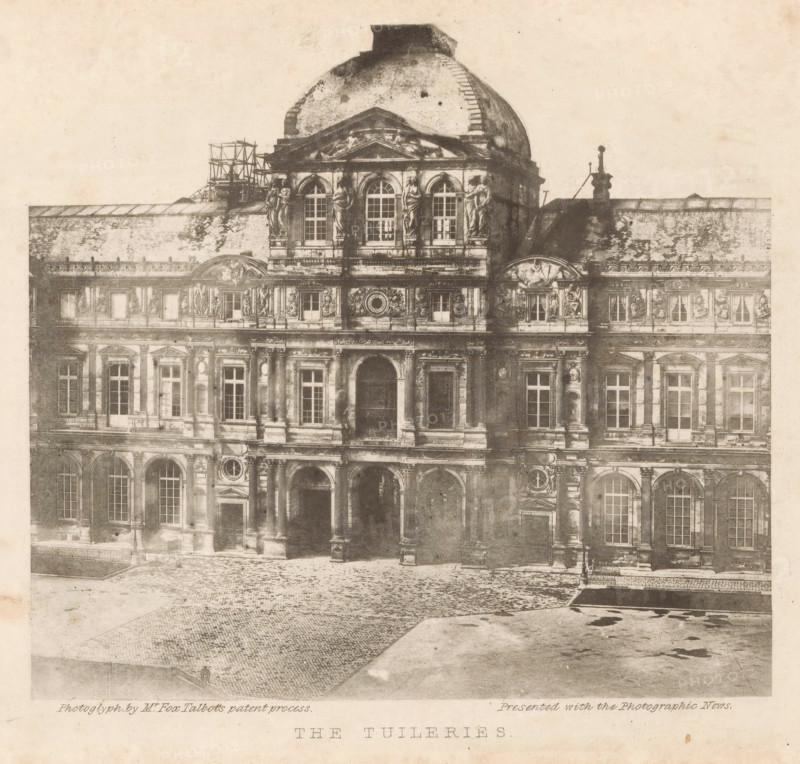 The Tuileries, Tuileries Palace in Paris, photomechanical print, inscription: 'Photograph by Mr. Fox Talbot's patent process - Presented with the Photographic News', photographer: Clouzard & Soulier, cliché maker: anonymous, printer (person): Brooker, William Henry Fox Talbot, 1858 - 1860, Clouzard & Soulier, Brooker, photographer, cliché maker, printer (person), paper, photoglyphic engraving, height 151 mm x width 166 mm, Print opposite title page., front facade, palace, Paris, Tuileries Palace, A sepia-toned photograph of a large classical building facade with ornate stonework, arched windows, columns, statues perched in niches and on ledges, decorative pediments and sculpted reliefs, a domed roof with visible wear and scaffolding at one side, tall ground-floor arches forming an entrance, cobbled pavement in front, simple lamp posts near the building, and a wide empty foreground leading up to the structure.