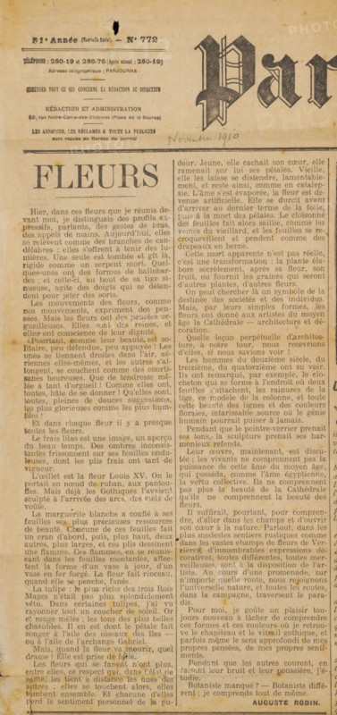 Newspaper clipping from archive Philip Zilcken, newspaper clipping, writer (clerical worker): Auguste Rodin, 1910-11-16, writer (clerical worker), printer (person), ink, materials by function, paper, printing ink, printing, height 425 mm x width 425 mm, Person, Philip Zilcken, A yellowed, aged newspaper page with a large headline at the left reading a single word in bold serif capitals, surrounded by dense columns of justified text in a serif typeface; a decorative, partially visible masthead with ornate blackletter lettering appears at the top right, and a narrow handwritten note in pencil sits beneath it; the page shows spots of foxing and small dark stains, as well as a small tear and hole near the top, and the paper edges are slightly worn and discolored; thin horizontal rules separate sections near the top, and smaller headings and blocks of text fill the page in uniform narrow columns.