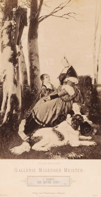 Reproduction of painting 'Der Mutter Gebet' by F. Wagner, Gallerie Moderner Meister, photograph, Genre scene of a mother with two children and a dog, praying before a crucifix on a tree, caption: 'Photograph after the original., GALLERIE MODERNER MEISTER, F. WAGNER, DER MUTTER GEBET, Verlag von Fr. Hanfstaengl in München, New York, Geo Kirchner & Co.., Registered, Déposé', photographer: Franz Hanfstaengl Kunstverlag A.-G., München, c. 1879 - c. 1900, Bavaria, Munich, pasteboard, paper, albumen print, height 248 mm x width 166 mm, height 321 mm x width 483 mm, A sepia-toned scene shows a woman seated on grass beneath tall trees, wearing a long dress with layered skirts and a headscarf, her hands clasped at her lap and her face turned upward; beside her a young girl kneels looking up toward the woman, dressed in a patterned garment with braided hair; at the woman's feet a small child reclines against her skirt with eyes closed, and a large dog with a thick coat lies in front of them, its...