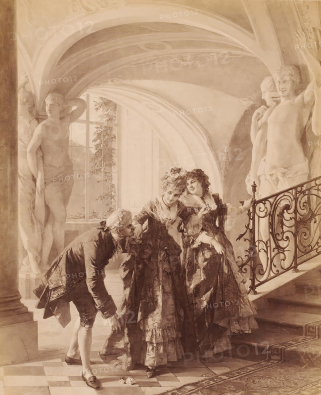 Reproduction of painting 'Liebesdienste' by Otto Erdmann, Gallerie Moderner Meister, photograph, Genre scene of two women by a staircase, and a man giving one of the women a hand kiss. In the background, arcades of a building, supported by large marble statues., caption: 'Photograph after the original., GALLERIE MODERNER MEISTER, O. ERDMANN, LIEBESDIENSTE., 798., 1881, Verlag von Fr. Hanfstaengl in München, New York, Geo Kirchner & Co.., Registered, Déposé', photographer: Franz Hanfstaengl Kunstverlag A.-G., München, c. 1881 - c. 1900, Bavaria, Munich, pasteboard, paper, albumen print, height 242 mm x width 198 mm, height 320 mm x width 483 mm, A softly lit interior scene showing three elaborately dressed women in layered, ruffled gowns standing near a decorative wrought iron staircase, one holding a folding fan and another leaning slightly toward a man who is bowing and offering his hand while holding a small object; the man wears a coat with ornate cuffs and knee breeches. The backgr...