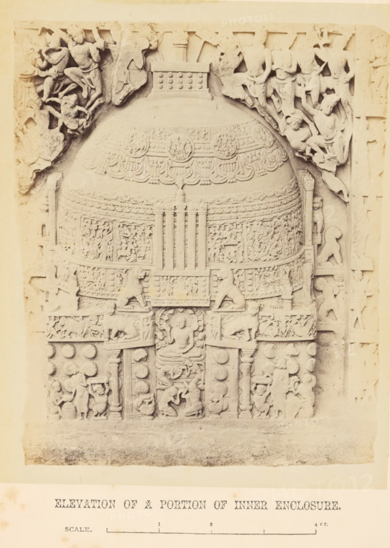 Relief with a religious scene, Amaravati, Andhra Pradesh, India, photograph, page, inscription: 'ELEVATION OF A PORTION OF INNER ENCLOSURE., SCALE.', inscription: 'AMRAVATI. PLATE LXXVI.', photographer: William H. Griggs, c. 1863 - in or before 1868, South India, paper, albumen print, height 221 mm x width 181 mm, Photo two pages after page 198., Hinduism, Buddhism, Jainism, A photograph of a carved stone relief showing a large rounded central dome-like structure covered in ornamental bands and intricate low-relief figures, flanked by carved human and animal figures in various poses. The central panel features a seated figure within a framed niche, with stylized lions and decorative motifs around. The upper sections show figures in dynamic stances and draped garments amid scrolling foliage, while the lower sections contain smaller narrative scenes and decorative rosettes. A plain margin surrounds the relief, and a separate lower strip contains printed content that is not described.