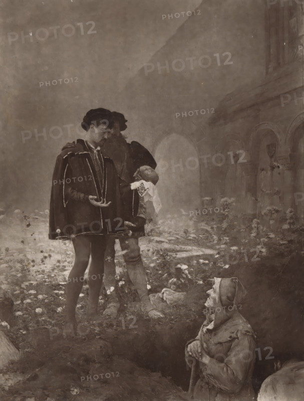 Hamlet et les Fossoyeurs, Reproduction of a painting of Hamlet and the gravediggers by Pascal-Adolphe-Jean Dagnan-Bouveret, reproduction, page, photomechanical print, inscription: 'SALON 1884.', name: 'DAGNAN BOUVERET (Pascal- Adolphe-Jean)', cliché maker: Lemercier (possibly), after painting by Pascal-Adolphe-Jean Dagnan-Bouveret, publisher: E. Francfort, Paris, 1879 - in or before 1884, photographer, paper, Woodburytype, Woodbury type, height 255 mm x width 192 mm, grave digger, Hamlet, Prince of Denmark, A sepia-toned scene showing two standing men in period clothing near the center, one facing slightly toward the viewer with a cape and decorative trim and the other partly obscured behind him holding a cloth to his face; both wear hats and knee-length garments with stockings and shoes. In the foreground to the right a seated figure in simple, worn clothing and a head covering clasps a staff and looks toward the standing men. The ground around them is strewn with debris and irregular...