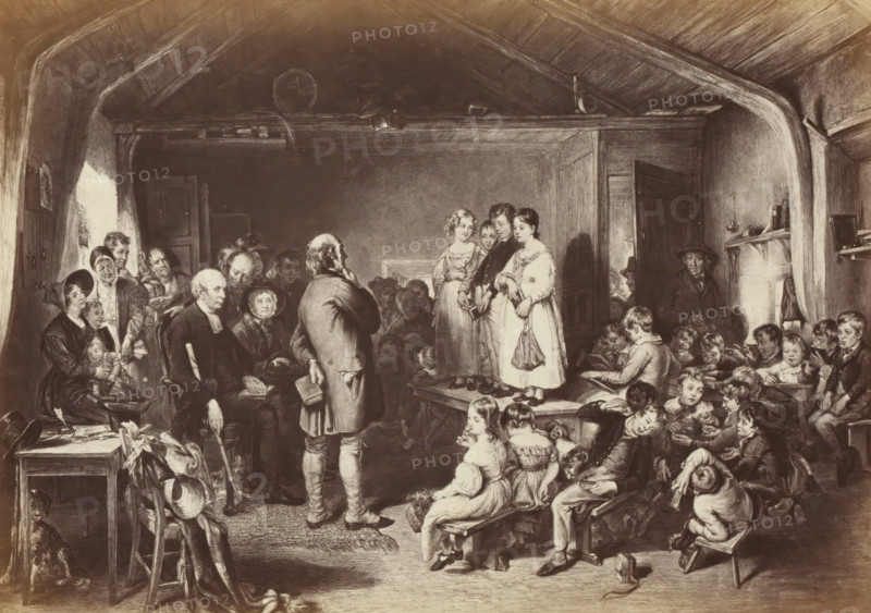 Photo reproduction of an engraving of Examination of a Village School, after the painting by Sir George Harvey, photograph, reproduction, page, photographer: Thomas Annan, after print by Frederick Bromley, after painting by George Harvey (Sir), c. 1865 - in or before c. 1870, Frederick Bromley, after print by, paper, albumen print, height 162 mm x width 227 mm, elementary school, class, form (school inspector), A crowded interior scene shows a vaulted wooden ceiling and exposed beams above a room filled with people of varying ages. At center foreground, a man stands with his back turned, holding a book, facing three children who stand on a raised platform; the children wear simple dresses and coats and one holds a small bag. To the left, seated and standing adults, some with head coverings, cluster near a doorway and a table with assorted items including a basket and fabric; one seated man holds a cane. To the right, many children sit on benches and the floor, some reading or looking t...