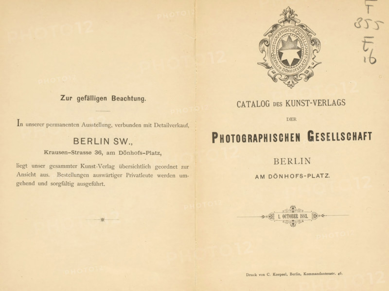 Catalog des Kunstverlags der Photographischen Gesellschaft Berlin 1. October 1883, book, name: 'Henri Hymans, Bruxelles', writer (clerical worker): various manufacturers, printer (person): C. Koepsel, Berlin, 1883, writer (clerical worker), printer (person), paper, albumen print, height 195 mm x width 130 mm x thickness 10 mm, A two-page spread of aged cream paper with a vertical fold down the center, featuring printed decorative elements and a shield-like ornate emblem near the top right with a circular medallion and ornamental flourishes, printed dark ink headings and blocks of smaller printed lines of text across both pages, a small decorative horizontal ornament near the lower center of the right page, a faint handwritten mark along the right edge, and slight creases and spots on the paper surface.