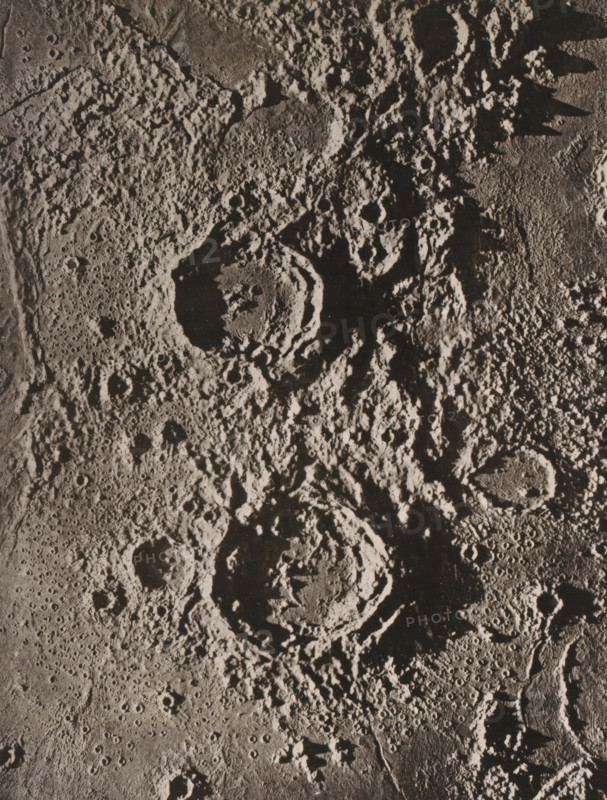 Plaster model of the moon craters Aristotle and Eudoxus, seen from above, Das Ringgebirge Aristotle und Eudoxus, page, photomechanical print, number: 'Tafel IX.', photographer: James Nasmyth, cliché maker: Strumper & Co, Hamburg (city), c. 1863 - in or before 1873, paper, collotype, photoprint, height 171 mm x width 132 mm, surface of the moon, Moon, A grayscale close-up of a heavily cratered, textured surface showing large circular depressions with raised rims surrounded by rough, uneven terrain and numerous smaller pits, shadows accentuating depth and irregular ridges, with areas of smoother, pockmarked plains contrasting against jagged, rugged highlands.