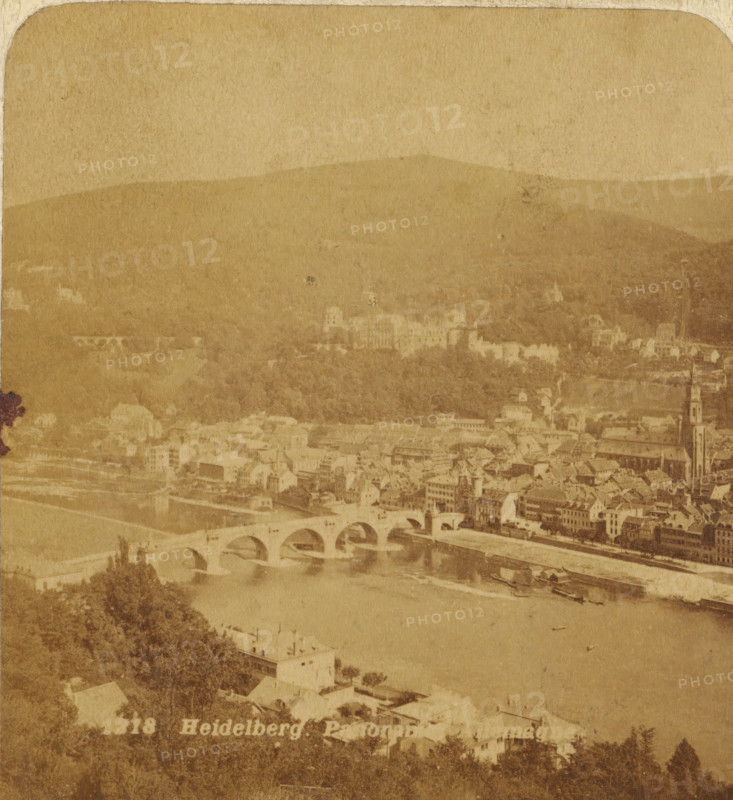 Heidelberg. Panorama. Germany, Panoramic view of Heidelberg, Germany, Views and landscapes in Europe, Africa and Asia, Geographical Sculpture Gallery, collected by MJ Broekhuijsen, Head of a school in Amsterdam, stereograph, Bottom left of photo numbered: 1318., annotation: 'A city on a river., The picture was taken on the right bank of the Neck. The river is, here, over 200 M. wide. Heidelberg is built partly on the slope of, the King's Chair (600 M. high.) In the middle in the background the, Heidelberg Castle.', Baden-Württemberg, publisher: Merkelbach & Co., Amsterdam, compiler (person in literature): Martien Johan Broekhuijsen, c. 1905, Merkelbach & Co., Martien Johan Broekhuijsen, photographer, publisher, compiler (person in literature), pasteboard, paper, albumen print, height 89 mm x width 178 mm, Part of a group of 52 stereophotos used in primary education as a supplement to school charts. The entire series consisted of 274 items in 10 categories (A to K)., prospect of city, t...