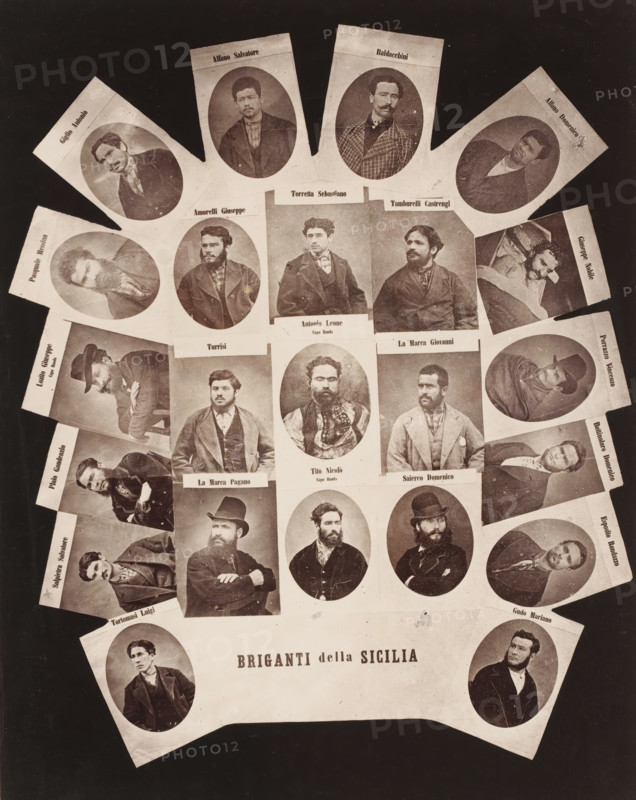 Collage with 23 portraits of Sicilian bandits, Briganti della Sicilia, photocollage, inscription: 'captured 1878, executed Palermo 1880', Sicily, 1878 - 1880, photographer, pasteboard, paper, albumen print, height 385 mm x width 309 mm, Person, Alfono Salvatore, Alfono Domenico, Bottinolaro Domenico, Exposito Rondazzo, Baldacchini, Salpietro Salvatore, Porrazzo Vicenzo, Giuseppe Nobile, Tortomaso Luigi, Torretta Sebastiano, Pasquale Messina, Lozito Giuseppe, Giglio Antonio, Gudo Mariano, Plaio Gaudenzio, Tamburelli Castrengi, Amorelli Giuseppe, La Marea Giovanni, Antonio Leone, Turrisi, Tito Nicolò, Saierco Domenico, La Marea Pagano, criminals, A large sepia-toned collage of individual oval and rectangular portrait photographs arranged in a roughly circular fan shape against a dark background, each portrait showing a man in period clothing with various facial hair styles and hats, many shown from the chest up and facing different directions, some seated and some leaning, with lighter p...