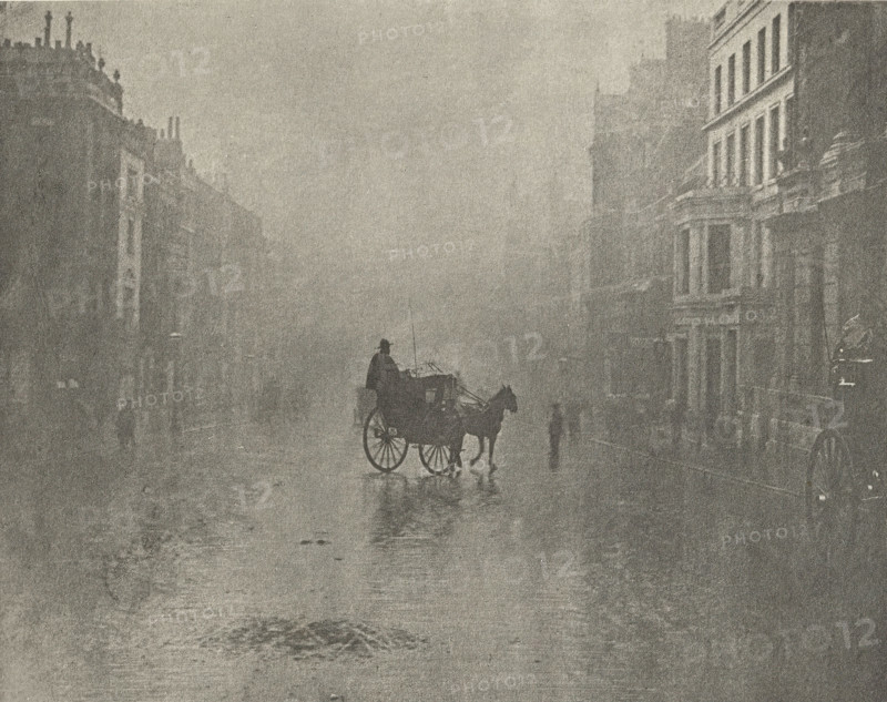 Carriage on the street in London, 'Fine day in London', photomechanical print, photographer: Hector Colard, London, cliché maker: Fillon & Heuse, printer (person): Charles Wittmann, Paris, c. 1891 - in or before 1896, printer (person), paper, photoaquatint, height 144 mm x width 182 mm, mist, fog, street, two-wheeled vehicle drawn by one animal, A foggy street scene in muted tones showing a horse pulling a small carriage with a seated driver, the horse and carriage casting a reflection on the wet pavement, flanked by tall multi-story buildings with visible windows and architectural details, and a few indistinct standing figures partially obscured by the haze.