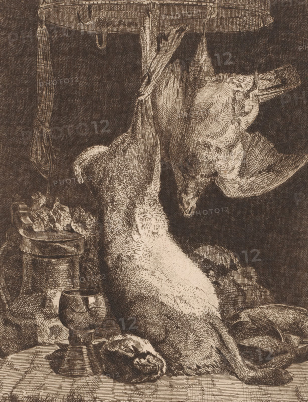 Still life with a hare and partridge at a game crown, print, printmaker: Paul Emile Nicolié, 1880, paper, etching, roulette, intaglio printmaking technique, roulette and plate tone, height 257 mm x width 198 mm, foodstuffs, still life of foodstuffs, rodents: hare, hunting trophies, walker and runner birds: partridge, A detailed sepia-toned etching showing a dead bird hung upside down by its legs from a circular hook, its head angled to the side with a long beak and textured feathers, positioned above a table that holds a goblet on a stemmed base, a rounded container with a lid, a small barrel or bucket filled with leafy items, and various pieces of food and draped fabric; shading and fine crosshatching create detailed textures on the bird, metal objects, and cloth against a dark background.