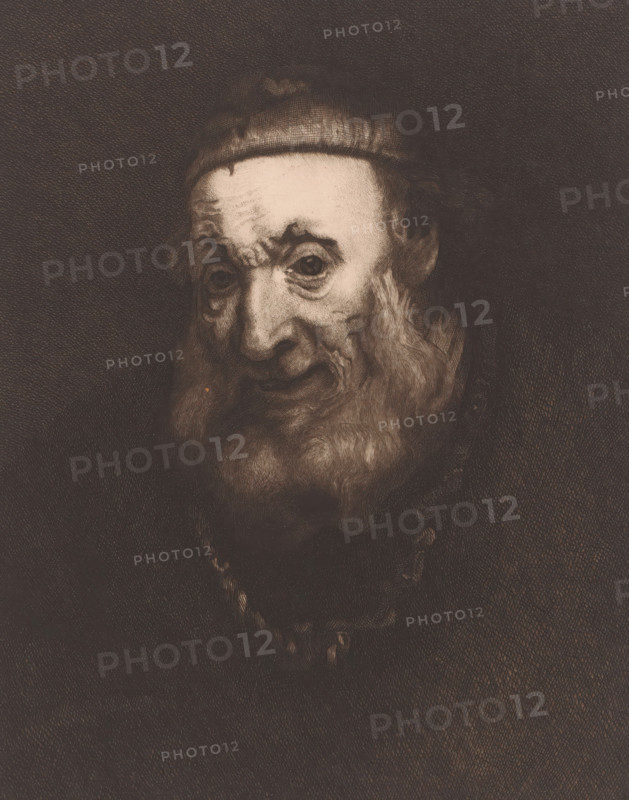 Head of an old man, print, printmaker: Charles Théodore Bernier (signed by artist), after painting by Rembrandt van Rijn, 1887, paper, chine collé, etching, intaglio printmaking technique, drypoint, plate tone and drypoint on chine collé, height 292 mm x width 215 mm, old man, A sepia-toned portrait of an elderly man with a rounded cap, deep-set eyes, pronounced wrinkles on his forehead and around his eyes, a prominent nose, and a full beard and mustache; the lighting highlights his face against a dark, textured background and the brushwork or engraving lines are visible across the image.