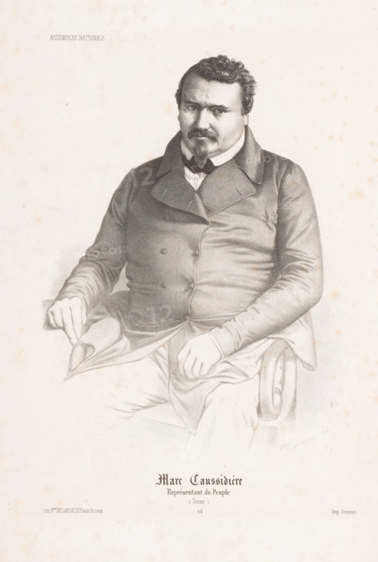 Portrait of Marc Caussidière, Marc Caussidière, Portraits of members of the National Assembly, Assemblée Nationale, print, Series number, 24, printmaker: Alexandre Lacauchie, printer (person): Jean-Baptiste Bazile Domnec, Paris, publisher: Delarue & Cie., Victor, 1848 - 1849, printer (person), paper, lithography, height 376 mm x width 243 mm, Person, historical persons, A seated man depicted in a detailed pencil or charcoal drawing wearing a dark double-breasted coat with wide lapels and a high-collared shirt, with a bow or cravat at the neck, short curly hair, a mustache and pointed goatee, one hand resting on his thigh and the other holding the edge of a draped fabric on his lap, the arm of a carved wooden chair visible under his right forearm, the portrait centered on a pale, slightly speckled background with faint tonal shading and subtle age spots.
