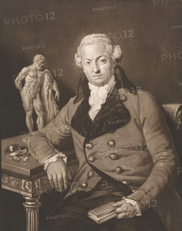 Self-portrait, print, printmaker: Josef Clarot, 1780 - 1820, paper, mezzotint, proof, height 381 mm x width 269 mm, Person, sculpture, portrait, self-portrait of artist, (story of) Hercules (Heracles), book, ornaments, jewels, A seated man in historical clothing with a fur-trimmed coat and ruffled cravat looks toward the viewer, his hair styled in a powdered, curled fashion. His right arm rests on an ornate table with a decorative edge, and his left hand holds a closed book. On the table beside his arm are a small open case and round objects arranged nearby. Behind and to the side of the man stands a nude male statue draped with a cloth, positioned on a plinth. The scene is rendered in sepia tones with a plain, darker background.
