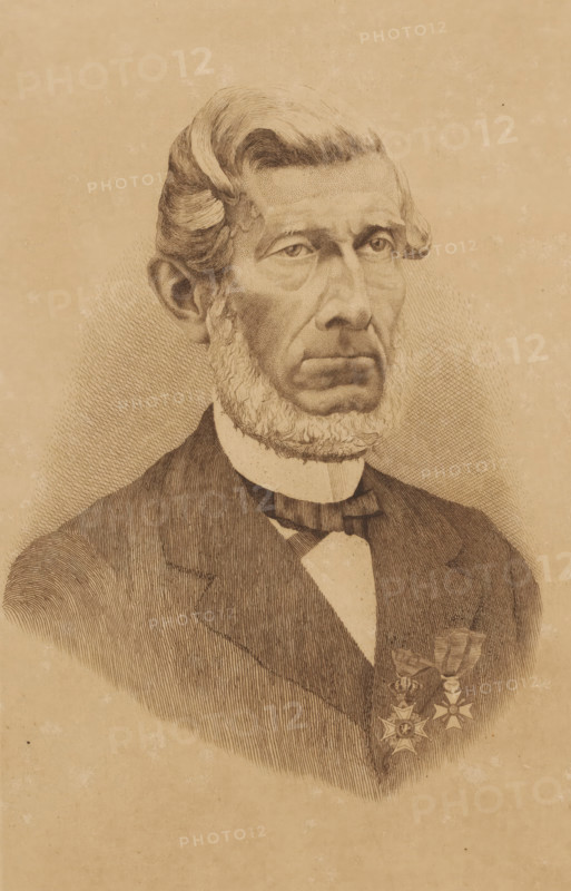Portrait of an unknown man, possibly Dorzée, print, inscription: 'Mois 2x m 1897', printmaker: Georges Montenez (signed by artist), 1897, paper, etching, intaglio printmaking technique, etching with plate tone, height 295 mm x width 199 mm, Titled in the inventory: Portrait of Mayor Dorzée., historical persons, adult man, beard, A sepia-toned engraved portrait of an older man shown from the chest up, featuring detailed line work. He has a high forehead with swept-back hair, pronounced sideburns that form a full beard along his jaw, and a serious expression with deep-set eyes and a furrowed brow. He wears a dark suit jacket over a light shirt with a high collar and a bow tie. Two decorative medals with ribbon bows are pinned to his jacket on the visible side. The background is plain with subtle crosshatch shading around the figure.