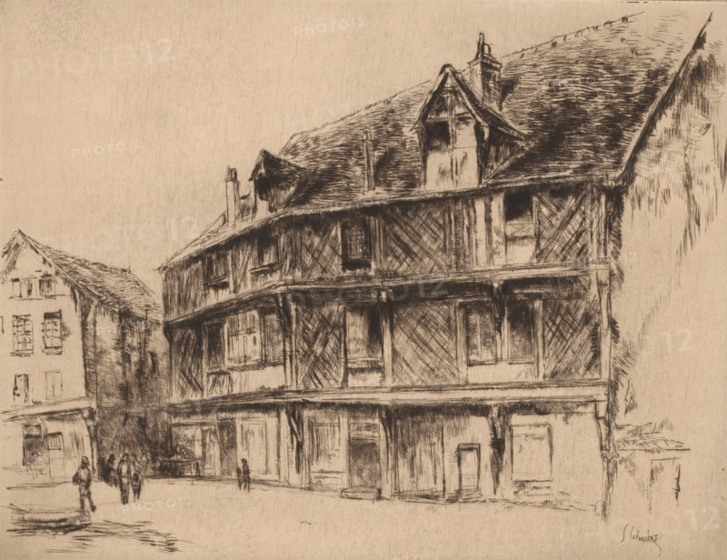 La maison du saumon (Chartres), Street with houses and walkers in Chartres, print, watermark, printmaker: Gustave Leheutre (signed by artist), 1928, paper, etching, drypoint, intaglio printmaking technique, height 210 mm x width 272mm, street, Chartres, A sepia-toned sketch of a street scene showing a large timber-framed building with visible wooden beams, a covered upper gallery, and steeply pitched roofs with dormer windows and chimneys, adjacent to smaller buildings with shuttered windows; faint figures walk along the street in front of the buildings, and simple ground and pavement lines define the foreground.