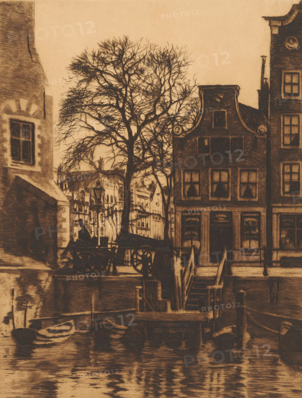 Overhaul at the Montelbaan Tower in Amsterdam, print, Viewed from the Oude Schans towards Oude Schans 4., watermark, printmaker: Willem Witsen (signed by artist), Amsterdam, c. 1912, paper, etching, aquatint, intaglio printmaking technique, aquatint and plate tone, proof, height 234 mm x width 183 mm, the usual house or row of houses, canals, waters (in city), city-view, and landscape with man-made constructions, Montelbaan Tower, A riverside scene rendered in a sepia tone showing narrow brick buildings with gabled roofs and multi-paned windows, a leafless tree with intricate bare branches standing in front of the buildings, a wooden staircase and dock structures leading down to the water, reflections of the buildings and dock visible on the rippled water surface, a small boat moored at the edge of the water, a horse-drawn cart and a figure seated nearby silhouetted against the lighter background, and lamp posts and architectural details of neighboring facades visible between the build...