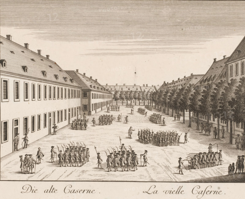 Die alte Caserne, Lavielle caserne, View of the old barracks, in Mannheim, Vues de Mannheim représentées sur vingt six planches, print, Numbered top right: 16., printmaker: Klauber, gebroeders, Augsburg, after drawing by Johann Franz von der Schlicht, publisher: Christian Friedrich Schwan, Mannheim, 1782, brothers, Bavaria, Baden-Württemberg, paper, etching, engraving, height 213 mm x width 280 mm, barracks, A detailed sepia engraving shows a broad courtyard flanked by long multi-story buildings with steeply pitched roofs and rows of dormer windows, a line of closely planted trees along one side, and numerous groups of uniformed figures arranged in formations and small gatherings across the open ground, some carrying long poles or weapons and others standing in conversation, with a few individuals walking or supervising, and patterned shading indicating cobblestones and fine crosshatching used for sky, roofs, and foliage.