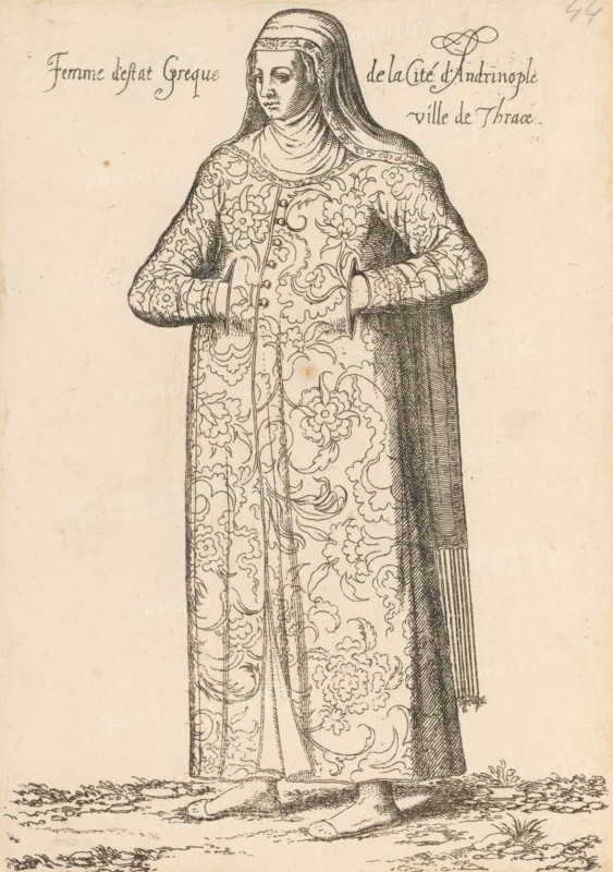 Femme d'estat Grecque de la Cité d'Andrinople ville Thrace, Greek woman, from Andrinople or Edirne in Thrace, print, album page, book illustration, Print is part of an album., printmaker: Léon Davent, after drawing by Luca Penni (attributed to), after drawing by Nicolas de Nicolay (possibly), publisher: Guillaume Rouille (I), Lyon, 1555 - 1568, Attributed to, paper, etching, pasted on album page, height 246 mm x width 172 mm, A woman shown standing and facing forward wearing a long ornate robe covered in floral and swirling patterns and a head covering that drapes over her shoulders, her hands tucked into openings at her waist, a long fringed cloak falling at her side, simple flat shoes visible beneath the hem, and a strip of ground with sparse vegetation under her feet.