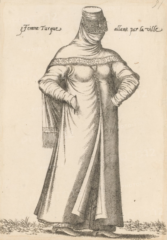 Femme Turque allant par la ville, Turkish woman on her way to the city, print, album page, book illustration, Print is part of an album., printmaker: Léon Davent, after drawing by Luca Penni (attributed to), after drawing by Nicolas de Nicolay (possibly), publisher: Guillaume Rouille (I), Lyon, 1555 - 1568, Attributed to, paper, etching, pasted on album page, height 250 mm x width 174 mm, A monochrome drawing of a standing person wearing a long flowing garment with layered drapery and detailed folds, a fitted bodice with buttons down the front, long sleeves with horizontal folds, and hands tucked into the sides of the garment; the head is covered by a wrapped veil and a cylindrical hat decorated with a patterned band, and a fringed shawl hangs from one shoulder; the figure stands on grass with the hem of the dress and visible shoes at the bottom.