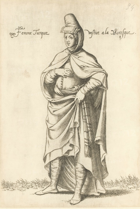 Turkish woman in North African Islamic clothing, Femme Turque vestue a la Moresque, print, album page, book illustration, Print is part of an album., printmaker: Léon Davent, after drawing by Luca Penni (attributed to), after drawing by Nicolas de Nicolay (possibly), publisher: Guillaume Rouille (I), Lyon, 1555 - 1568, Attributed to, paper, etching, pasted on album page, height 258 mm x width 176 mm, A monochrome engraving of a standing figure wearing layered draped garments and a tall rounded headpiece with a rectangular ornament at the forehead, a cloak fastened at the throat that falls over the shoulders, a gathered skirt held with one hand, a belted waist with decorative buttons, long fitted sleeves, and ankle-high footwear; the figure stands on a ground with short grass and faces slightly to one side with a calm facial expression.