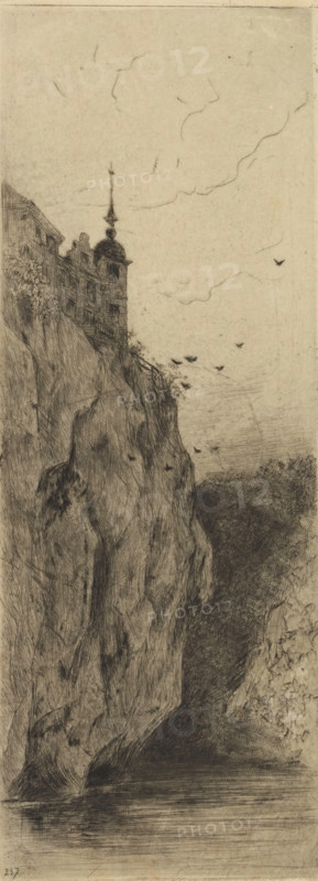 View of Walzin Castle, Le château de Walzin (near Dinant), print, printmaker: Philip Zilcken (signed by artist), 1890 - 1930, paper, drypoint, intaglio printmaking technique, drypoint on zinc, with plate tone, height 246 mm x width 97 mm, rocks, landscape with tower or castle, Dinant, Walzin Castle, A tall rocky cliff rises from a body of water, its textured surface rendered with dense, etched lines and shaded areas. Near the top of the cliff a multi-story building with a tower and a pointed spire sits partially visible, its windows and roofline sketched in dark strokes. Small dark shapes resembling birds are scattered in the sky and near the cliff edge. The sky is lightly marked with faint, curving lines suggesting clouds. The water at the base is calm with horizontal hatch marks indicating reflections, and darker, heavily shaded foliage or rock fills the distant recess beside the cliff.