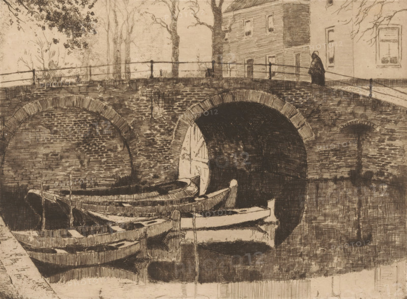 Bridge over a canal, print, Five rowing boats in the water on the left., printmaker: Cornelis Vreedenburgh (signed by artist), 1914, paper, etching, drypoint, intaglio printmaking technique, height 147 mm x width 199 mm, rowing-boat, canoe, bridge in city across river, canal, A monochrome etching showing a brick arch bridge spanning a waterway with the dark opening of a tunnel beneath one arch and a shallower arch visible beside it, wooden rowboats moored in the foreground with visible planks and oars, a stone or paved edge along the near side, a railing running along the top of the bridge, bare trees and foliage rising behind the bridge, a multi-story building with several windows adjacent to the bridge, and a solitary figure standing on the bridge near the building.