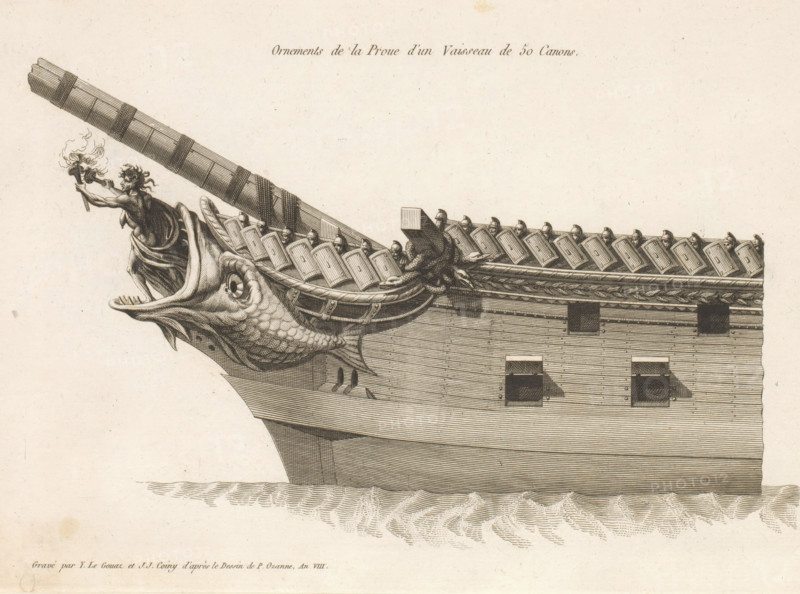 Prow and figurehead of a sailing ship with 50 guns, Ornements de la proue d'un vaisseau de 50 canons, Ornements de la proue de différents vaisseaux, Bow ornaments of various vessels, print, album page, ornament print, Series number, 12, 24, This print is made part of an album., printmaker: Joseph Coiny, printmaker: Yves Marie Le Gouaz, after drawing by Pierre Ozanne, 1799 - 1800, Joseph Coiny, Yves Marie Le Gouaz, Pierre Ozanne, printmaker, after drawing by, paper, etching, engraving, etching and engraving, cut off within the plate edge, pasted in an album, height 224 mm x width 316 mm, sailing-ship, sailing-boat, parts of ship's exterior: bow, A detailed etched depiction of a ship's prow showing the carved head of a large fish with an open mouth and visible scales, a long beak-like snout, and textured fins; above the fish a draped human figure reaches forward holding a torch with flames, and a long decorated spar extends from the prow with wrapped bands; a row of small helmeted figure...