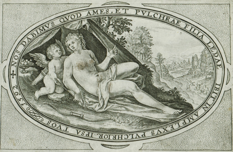 Venus, Gods and goddesses involved in the Judgment of Paris, print, album page, Landscape with Venus and her companion Cupid. In the frame, a Latin inscription referring to the role Venus played in the Judgment of Paris. She is one of the three goddesses whom Paris had to judge. She promised to reward Paris with the love of any woman he chose. This print is part of an album., printmaker: Crispijn van de Passe (I), Cologne, 1592, 1635 - 1660, North Rhine-Westphalia, paper, engraving, height 94 mm x width 142 mm, The print has been cleaned with a pen. In the past, someone scratched the cross and breasts of Venus with a pen., (story of) Venus (Aphrodite), An oval engraving shows a reclining nude woman draped with a cloth, her body turned slightly with one arm raised and the other resting near her thigh, her hair loose and wavy. Beside her is a winged cherub holding an arrow and a quiver, looking toward the woman. Behind them a tent-like drapery forms a dark backdrop, and to the right a la...