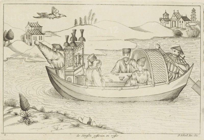Chinese people at a table on a boat, Der Sinesen gastereien zu wasser, Chinese customs, print, album page, ornamental print, Series number, 2, 12, Landscape with a boat, on which three Chinese figures are sitting at a table and drinking tea. Print is part of an album., printmaker: Pieter Schenk (II), Amsterdam, Leipzig, 1727 - 1775, paper, etching, height 172 mm x width 252 mm, landscapes in the temperate zone, Chinese, boat propelled by man or animal, tea-ceremony - CC - out of doors, A line drawing shows a boat on water with a curved hull and a lattice-covered canopy, containing four seated figures wearing traditional garments and hats seated around a small table with cups, while two oarsmen in distinctive hats and patterned sleeves stand at opposite ends of the boat holding long oars; decorative objects and vessels are arranged on a small ornate cabinet near the center of the boat. In the background there are gently rolling hills, a cluster of simple buildings with tiled roofs and a...