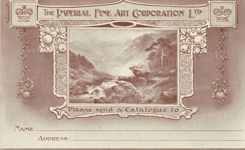 Order card from The Imperial Art Corporation, print, photograph, postcard, Painting of a deer in a landscape in a frame with fruit and two crowns., after painting by Ernest Walbourn (possibly), after design by anonymous, c. 1900 - c. 1925, printmaker, photographer, paper, autotype, height 81 mm x width 133 mm, hoofed animals: deer, A decorative sepia-toned design featuring an ornate rectangular frame with patterned borders and floral motifs surrounding a central landscape image of a river flowing through a valley with mountains in the distance and a stag standing on a grassy bank near trees, flanked by vertical vine-like garlands ending in clustered round fruit shapes, with ornamental crests at the top corners and ornamental scrollwork extending below the central image above a blank lined area.