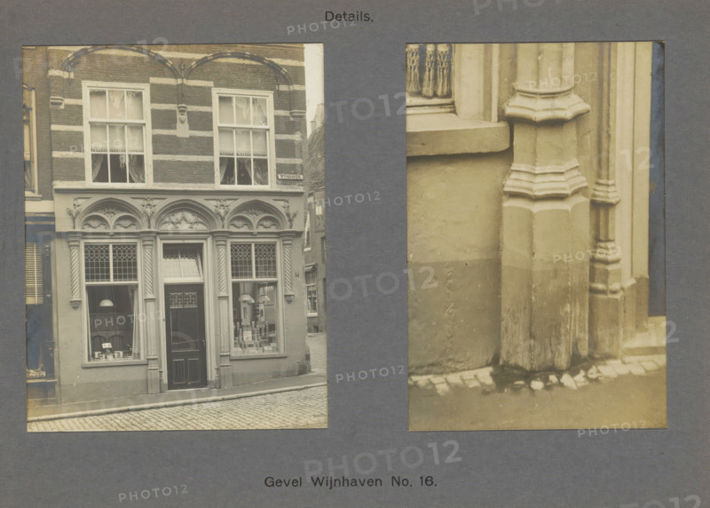 Facade Wijnhaven No. 16. Details, Facade and a pilaster of a building on the Wijnhaven in Delft, photograph, inscription: 'Delft. Early 16th century.', inscription: 'The right of reproduction of these photos is reserved by the Publisher.', number: '26', Delft, c. 1900 - c. 1904, photographer, paper, pasteboard, gelatin silver print, developed gelatin silver print, height 167 mm x width 223 mm, half-column, pilaster, architecture, ornament derived from architectural details, A sepia-toned image shows two adjacent photographic panels mounted on a textured dark background, the left panel depicting a building facade with patterned brickwork and horizontal lighter bands, arched decorative stonework above tall windows, a recessed doorway with a paneled door and leaded glass panes, display windows with visible objects and hanging lamps, and a cobbled street in front, while the right panel shows a close-up of a stone column and wall with layered molding, a windowsill, and a section of the pave...