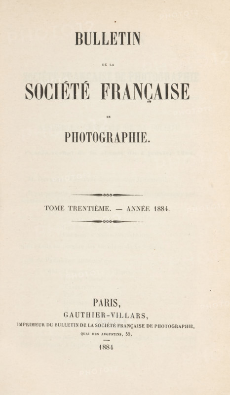 Bulletin de la Société française de photographie. Tome trentième - année 1884, book, number: '30', printer (person): Gauthier-Villars, Paris, 1884, printer (person), pasteboard, biological material, paper, leather, marbled paper, blotting paper, letterpress printing, cloud marbling, Spanish marbled paper, gold print, color on cut, collotype, height 240 mm x width 162 mm x thickness 22 mm, A vertically oriented aged paper page with large bold serif headings centered near the top and middle, smaller serif lines of text and decorative horizontal ornaments between blocks of text, a light beige background with subtle texture and tiny speckles, and a centered block of smaller text and ornamental marks toward the lower half.