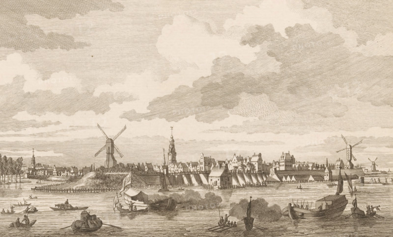 Arnhem seen from across the water, print, 1700 - 1750, printmaker, paper, etching, height 165 mm x width 222 mm, city-view, and landscape with man-made constructions, Arnhem, A wide riverside scene rendered in fine engraving lines shows a town skyline with rows of gabled buildings, spires, and towers along the far bank, punctuated by several windmills with four sails. The foreground features calm water with multiple small boats and barges, some with figures aboard and one larger vessel moored near the shore, while a shoreline with trees, docks, and structures frames the town. Above, a broad sky filled with layered, textured clouds stretches across the scene.