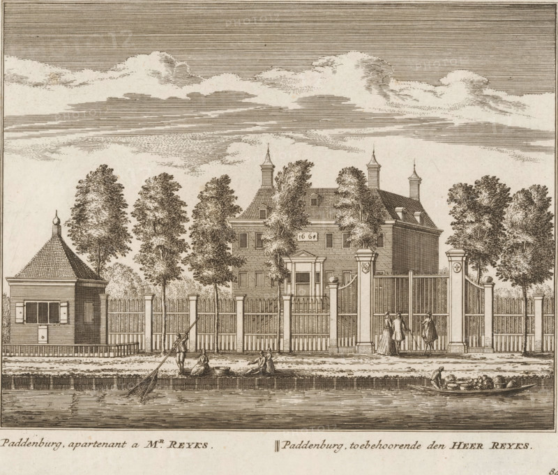 View of the country estate Paddenburg, near Baambrugge, Paddenburg, apartmentnant to Mr. Reyks, belonging to Mr. Reyks, print, book illustration, Series number, 84, 100, printmaker: Abraham Rademaker, publisher: Leonard Schenk, Amsterdam, 1730, paper, etching, three binding holes in the left margin, height 172 mm x width 200 mm, An engraved scene shows a gated estate with a large house behind a tall wooden fence and stone pillars, flanked by trees and smaller buildings, a river in the foreground with a small boat and figures near the water, a few people standing by the gate, and a sky filled with layered clouds.