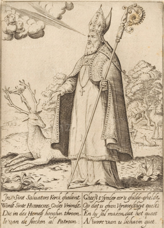 H. Hubertus, print, Netherlands, 1600 - 1699, printmaker, paper, engraving, etching, height 160 mm x width 115 mm, the hunter Hubert(us), bishop of Maastricht and Liège, possible attributes: hounds, hunting horn, key, stag with crucifix, (bishop's) stole, An engraved scene shows a bearded man wearing ornate bishop’s vestments and a tall mitre, holding a long crozier in one hand and gesturing with the other; a cross hangs from his chest and decorative patterns run along his cloak edges. A reclining stag with large antlers rests near his feet, and a small crucifix appears entangled in the antlers. In the background a landscape of trees and two additional deer is visible, one facing a kneeling human figure. In the sky a cluster of clouds contains two cherubic faces and a beam of light extends from the clouds toward the bishop’s head. The lower portion of the image contains a block of hand-lettered lines separated into columns.