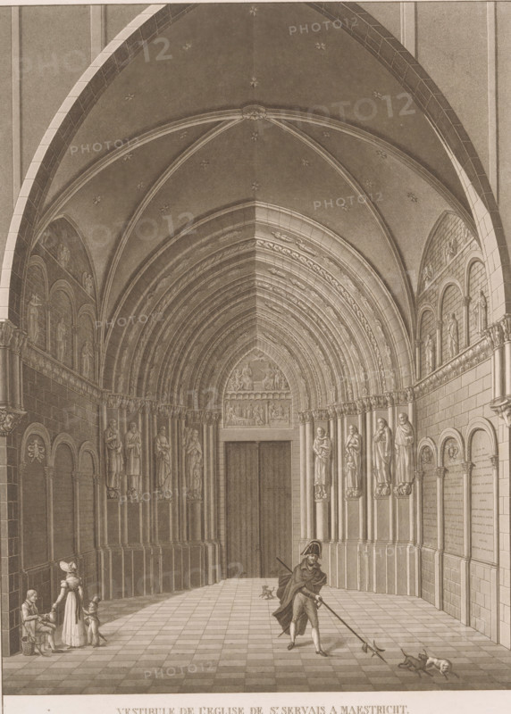 View of the Mountain Portal of the Basilica of St. Servaas in Maastricht, Vestibule de l'Eglise de St. Servais a Maestricht, print, book illustration, publisher: André Benoit Steven (II), Ghent, 1827, André Benoit Steven (II), printmaker, publisher, paper, etching, aquatint, height 307 mm x width 227 mm, A tall vaulted interior with ribbed arches and decorative stars on the ceiling leads to a large closed doorway set within concentric carved archways; the side walls feature rows of sculpted figures mounted on columns and inset arched panels, with patterned stone blocks and ornamental friezes; the tiled floor forms a checker pattern stretching toward the doorway; a cloaked figure wearing a hat stands near the foreground holding a long pole with a forked end that reaches toward two small dogs on the floor; to the left a seated person and a standing woman with a child are near the wall, and a small figure in a hat kneels beside them; wall-mounted plaques and rounded niches line the right ...