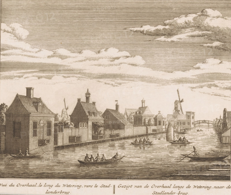 Vuë du Overhaal, le long du Wetering, vers le Stadlanderbrug, Gezigt van de Overhaal langs de Wetering, naar de Stadlander-brug, Gezicht op de wetering richting de Stadlanderbrug, print, book illustration, Gezicht van de Boerenwetering ter hoogte van de latere Stadhouderskade naar Stadlanderbrug, ter hoogte van de toekomst Albert Cuypstraat., printmaker: Abraham Rademaker, publisher: Leonard Schenk, Amsterdam, 1730, paper, etching, height 166 mm x width 195 mm, A wide waterfront scene rendered in a monochrome etched style shows a row of gabled buildings along a canal with small boats and rowboats on the water; several figures sit or row in the boats, and one person stands at the stern of a boat using a pole; the buildings feature varied rooflines, chimneys, small windows, and doors, with a windmill and a bridge visible in the distance; the sky above is filled with horizontal-lined shading and scattered clouds.