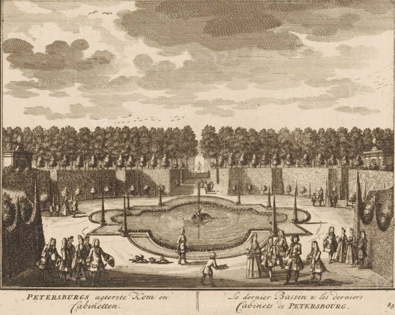 Petersburg's rear bowl and cabinets, The last basin & the last cabinets of Petersburg, View of the garden with cabinets of the house of Petersburg, print, book illustration, Series number, 85, 98, printmaker: Daniël Stopendaal (possibly), publisher: widow Nicolaes Visscher (II), Amsterdam, 1719, Daniël Stopendaal, widow Nicolaes Visscher (II), printmaker, publisher, paper, etching, height 159 mm x width 202 mm, A detailed ink engraving shows a formal garden with a large oval fountain at its center, water spraying from a central feature and pathways radiating outward, bordered by low hedges and tall, narrow trees. Numerous figures in period clothing, including men in coats with hats and women in long dresses, are walking, standing, and conversing along the paths and near the fountain, with a few attendants carrying trays. In the background a straight avenue lined with dense rows of trees leads to a sculpted urn or pedestal framed by clipped hedges, and two small classical pavilions sit ...