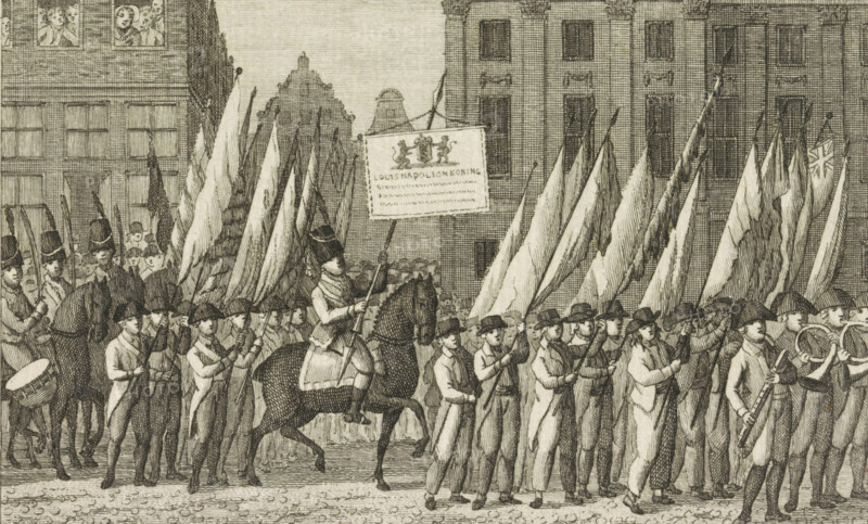Transfer of the Victory Banners to Amsterdam City Hall, 1806, print, By order of King Louis Napoleon, the victory banners are transferred to Amsterdam City Hall, August 1, 1806. A procession on foot and on horseback with banners captured from the enemy. In the center, a horseman with a banner made for this occasion., printmaker: Cornelis Bogerts, Netherlands, 1806 - 1816, paper, etching, height 112 mm x width 171 mm, Used as an illustration in: Arend Fokke Simonsz. De vaderlandsche historie in themata. Amsterdam: AB Saakes, 6th edition 1816., Person, Louis Napoleon (King of Holland), trophy, battle, war, military parade, pageant, ceremonial procession, parade, installation of a ruler, Amsterdam, Amsterdam City Hall (1655-1808), Period, 1806-08-01, A dense scene of a marching procession fills the image, with rows of men in period clothing and hats carrying long flags and poles, a mounted figure in uniform atop a horse near the center holding a banner, musicians with drums and wind instr...