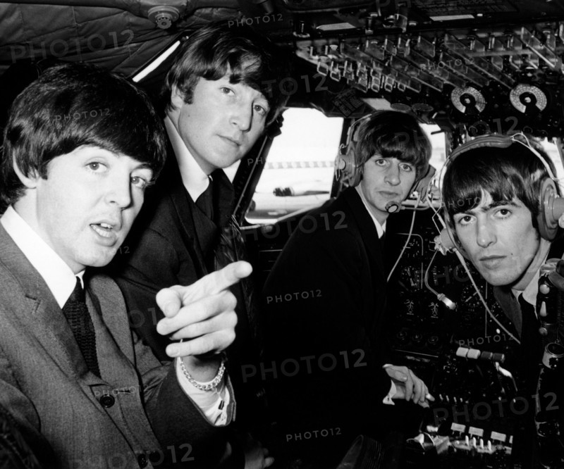 Beatles pop band in the cockpit of an aircraft on the way to the Northern Premiere of a 'Hard day's Night' in Liverpool.
13th July 1965 
 *** Local Caption *** rescan -  - 28/04/2010