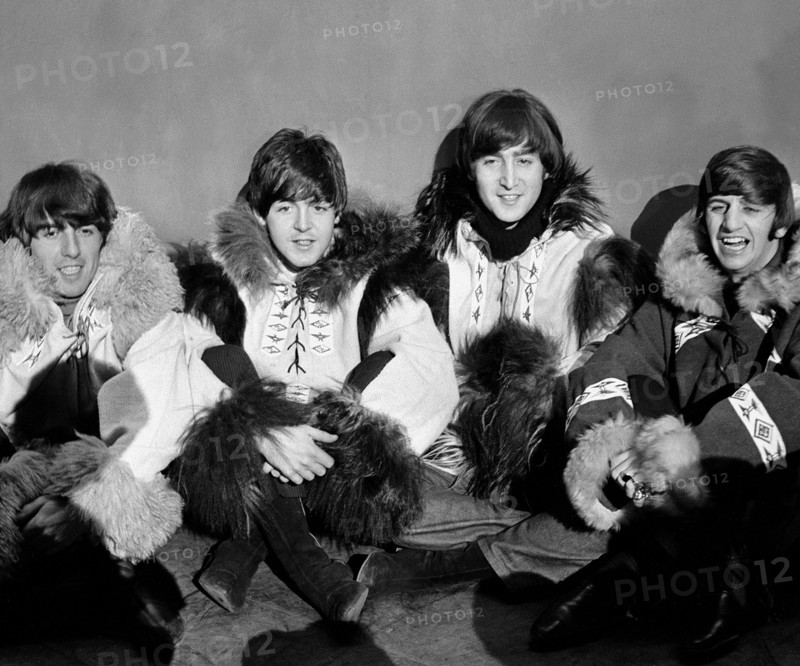 The Beatles pose for a group shot wearing eskimo outfits