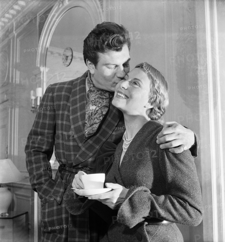 Michele Morgan, famous French film star arrived in London today to be guest of honour at the gala premiere of her new film "The Seven Deadly Sins" at the Cameo, Polytehcnic Theatre with her husband and film star Henry Vidal. December 1952 C6084