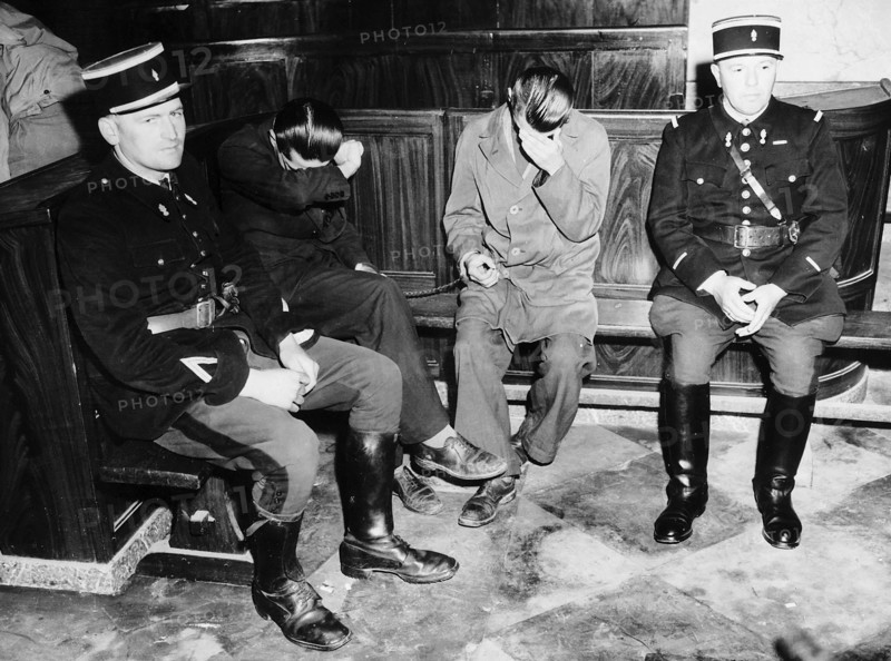 WW2   Frenchmen convicted of espionage 1944.   Two convicted French students who were accused of espionage against the Allies and given imprisonment for life with hard labour after being tried before a military tribunal in a French courthouse at Cherbourg