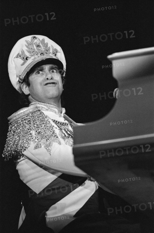 Elton John performing in concert during his "Jump Up Tour". 5th December 1982.