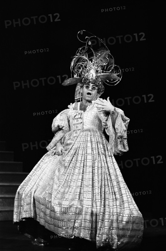 Elton John brings the house down singing "There Ain't Nothing Like a Dame" in a charity show at London's Theatre Royal. 2nd December 1984.