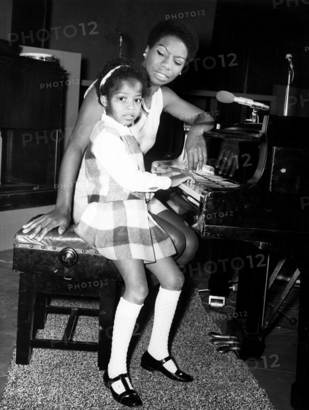 American singer, Nina Simone, in the UK recording a television programme called 'Sound of Soul' for London Weekend Television. Her 5 year old daughter Lisa loves to watch her mother at the studio, and already she is playing the piano. Wembley, London. 28th May 1968.