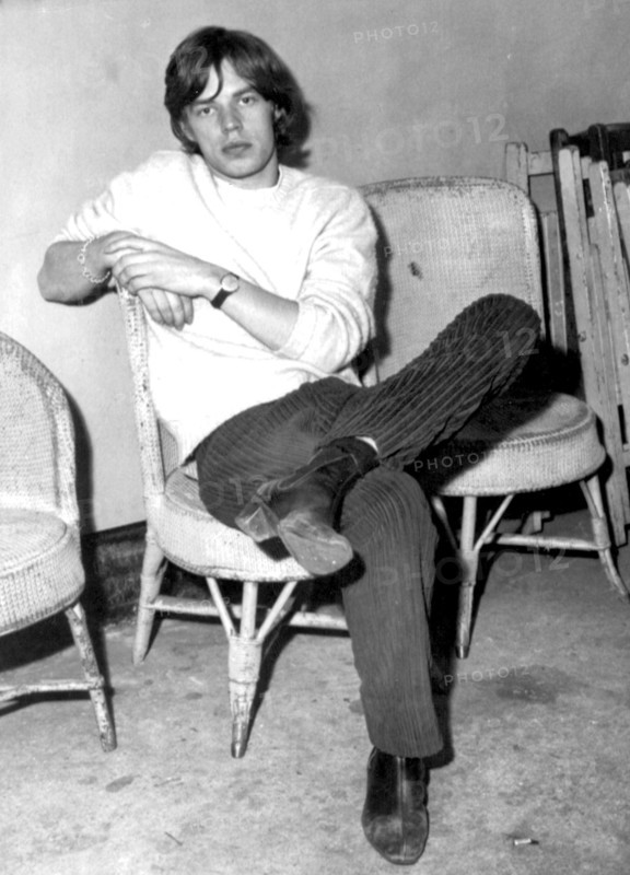 Mick Jagger sitting backstage, 21 September 1964.